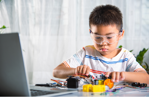 boy playing robotics