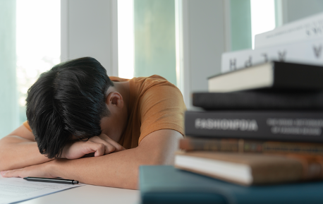 kid sleeping while studying
