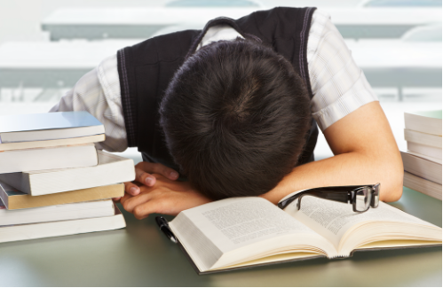 student sleeping while studying