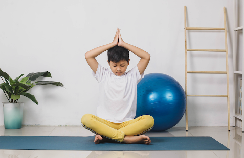 kid doing yoga