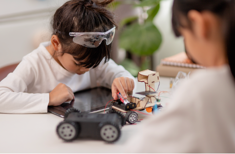 girl using tablet for robotics